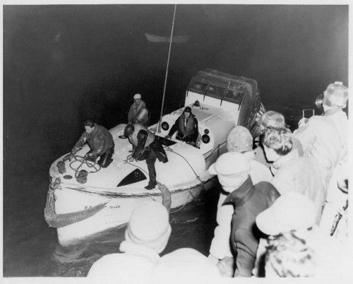Webber and his crew arrive back safely at their base with 32 of the Pendleton's survivors on board the Coast Guard motor lifeboat. EN3 Andrew Fitzgerald is on the bow ready to handle the tie up at the pier. Photo by Richard C. Kelsey, Chatham, Mass. Photo credit: Cape Cod Community College.